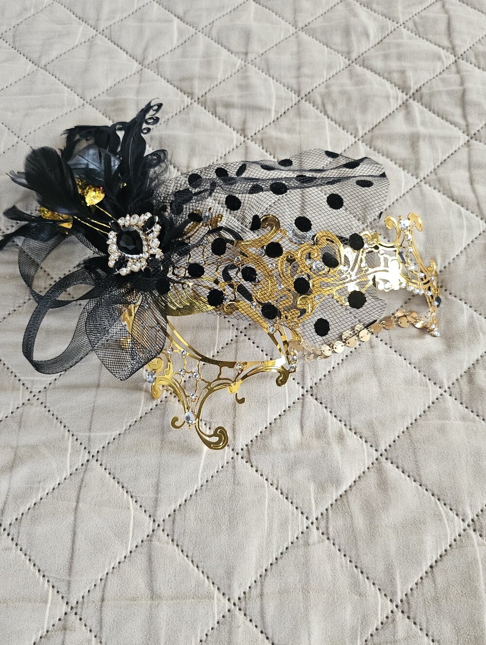 Black & gold masquerade mask with black polka dots on sheer fabric & Feathers